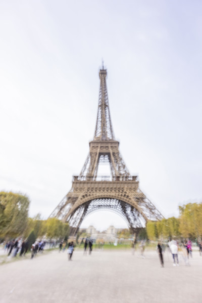 Tourists near Eiffel Tower, blurred motion. Paris, Ile de France, France.