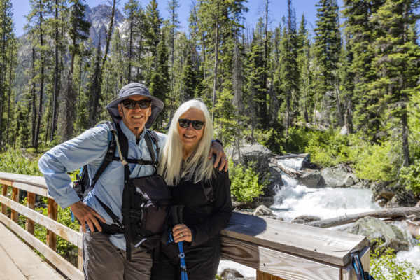 Portrait of senior hikes in Sawtooth Mountains by Redfish Creek. Stanley, Idaho, USA.