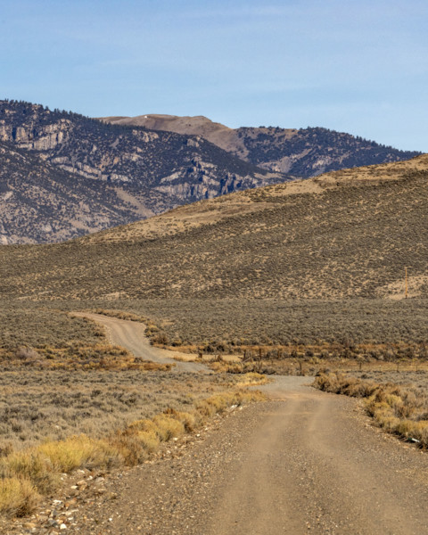 Empty rural dirt road over Trail Creek Pass. Mackay, Idaho, USA.
