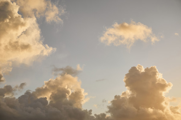 Puffy Cumulus clouds at sunrise. New York City, New York State, USA.