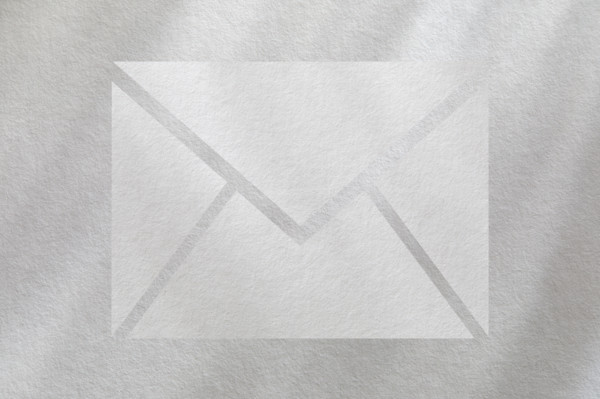 Mail icon on white textured background. New York City, New York State, USA.