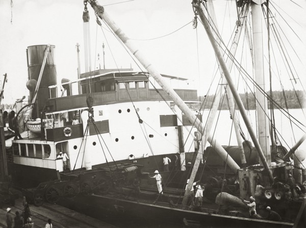Unloading a bogie from SS Harmonides. Close up view of the cranes onboard SS Harmonides lowering a