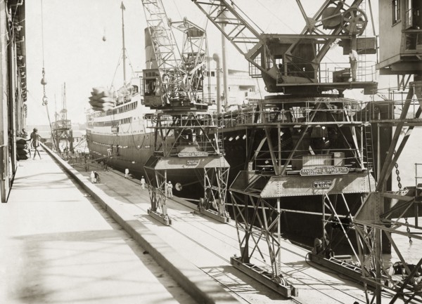 Dockside view at Kilindini harbour. SS Franconia and cranes on the dockside at Kilindini harbour.