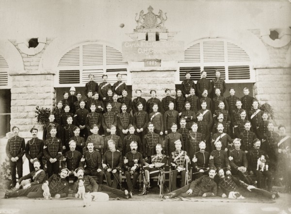 G.H. Gough's Troop. Portrait of a British regiment of the Indian Army in uniform. A sign within the