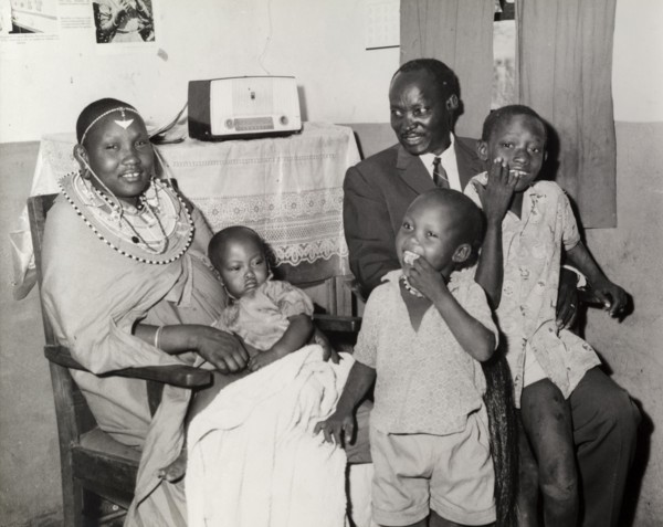 A 'modern' Maasai family. Portrait of a 'modern' Maasai family inside a home decorated with