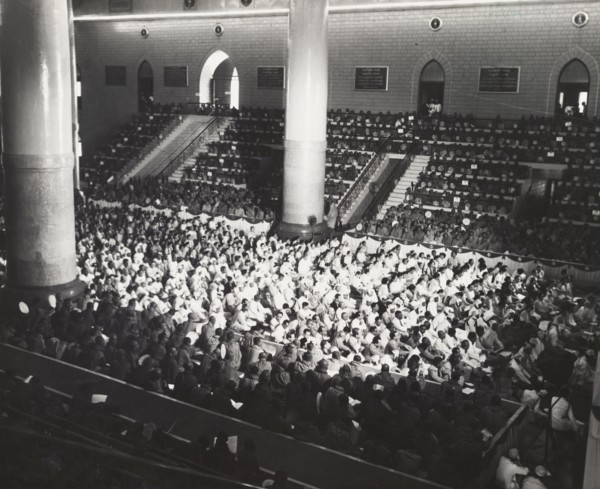 The congregation at the sixth Buddhist Synod. A Buddhist congregation packs out a large hall during