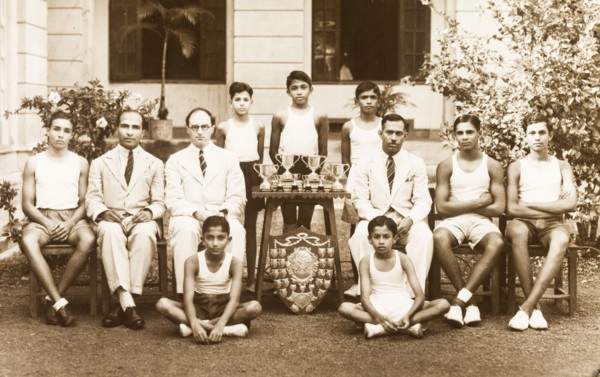 Sports team at the Royal College of Colombo. Outdoors portrait of a sports team with their trophies