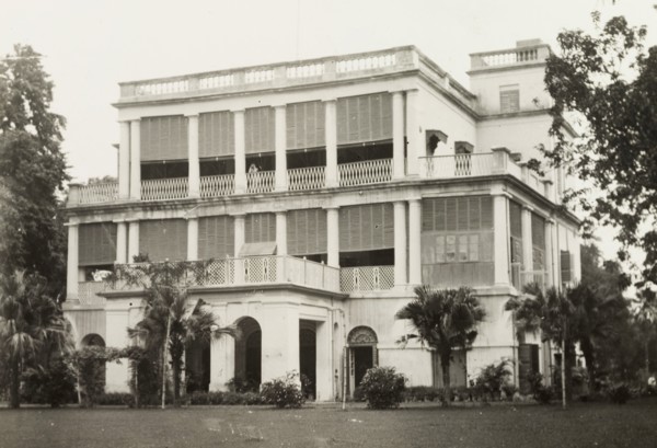 facade of a colonial-style building. The colonnaded facade of a two-storey, colonial building,