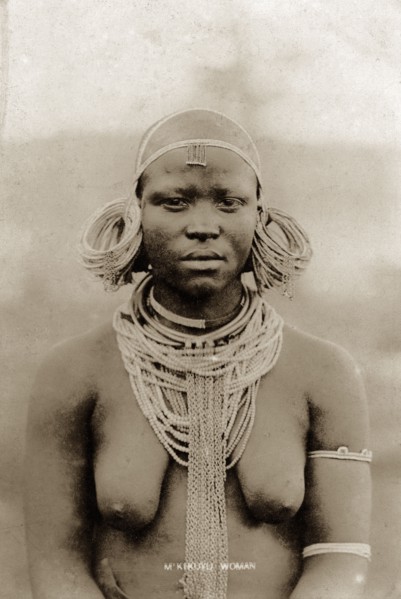 Kikuyu woman. Half-length portrait of a semi-naked Kikuyu woman wearing neck chains and heavy