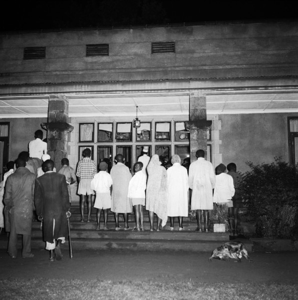 Exclusive entry at the SJAK dance. A group of African spectators watch a dance held for the Sports