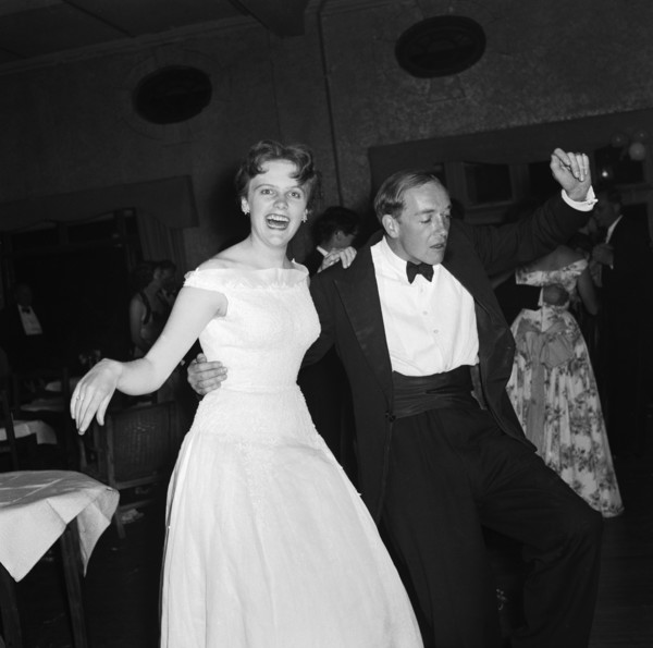 On the dancefloor at the SJAK dance. A formally dressed couple enjoy themselves on the dance floor