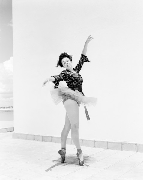 Sonja in Japanese costume. Sonja poses wearing theatrical costume comprising a tutu and ballet