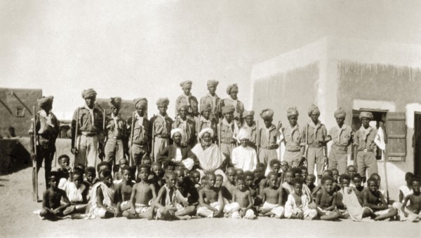 African scout group. Portrait of an African scout group in Sinkat. Uniformed scouts carrying sticks