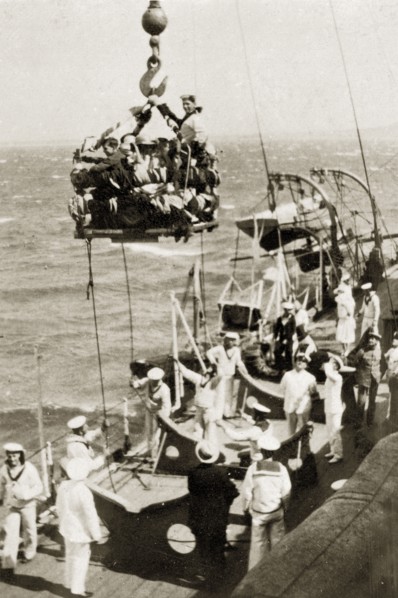 Children's party on the high seas. A group of children packed tightly onto a small platform are