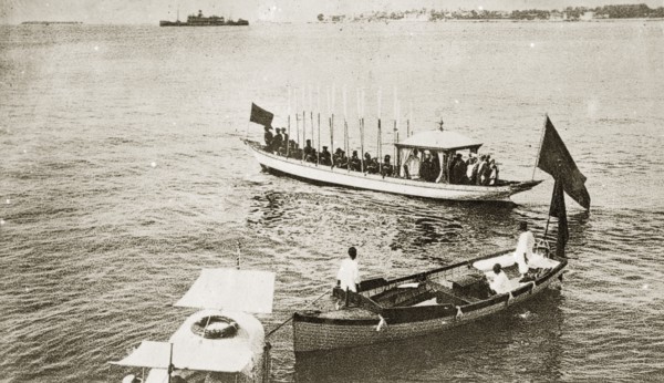 Sultans and Sheiks aboard a barge. A Sultan and Sheiks aboard an official state barge decorated