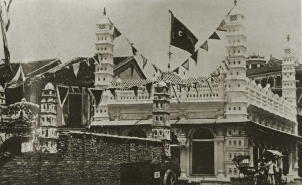 Singapore mosque. Strings of flags decorate an Indian-style mosque in the centre of town.