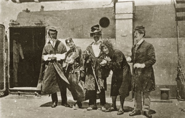 Comedians aboard HMS Hood. A group of comedians aboard HMS Hood dressed in a variety of character