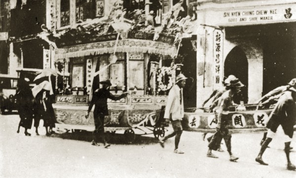 Chinese funeral carriage. An elaborately decorated funeral carriage adorned with wreaths, banners