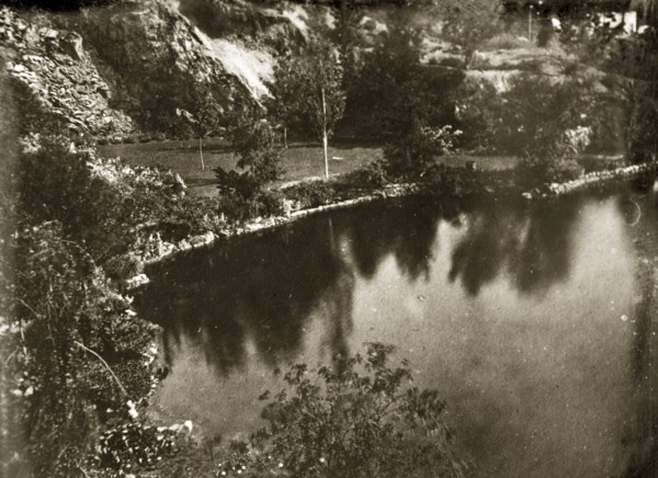 Lake at Butchart gardens. View of a lake and landscaped scenery at Butchart gardens. Victoria,