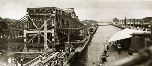 The Gatun locks at Panama. A warship of the British Special Service Squadron enters one of the
