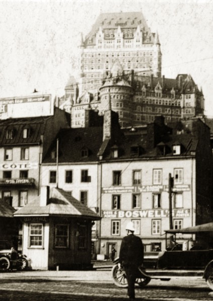 Old town, Quebec. View of shopfronts in the old town with the Chateau Frontenac Hotel visible in