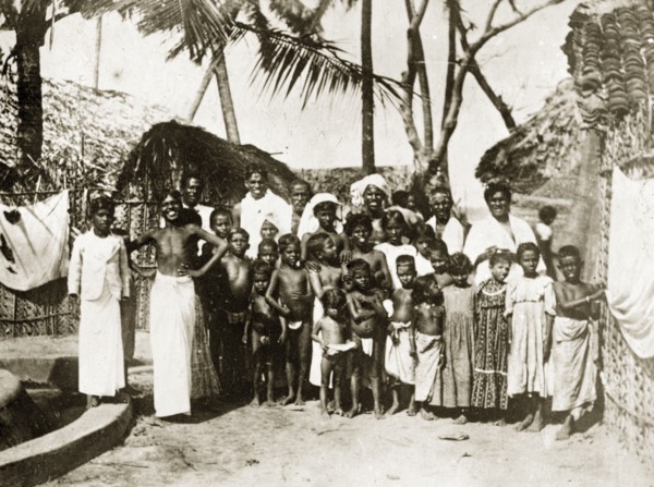 Inhabitants of a Ceylonian village. A large group of Ceylonian adults and semi-naked children