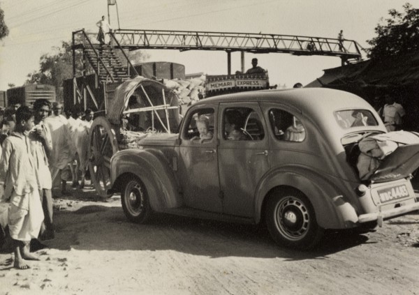 Journey to a dak bungalow. "David and Marjorie's car with Caroline at the window, held up in a