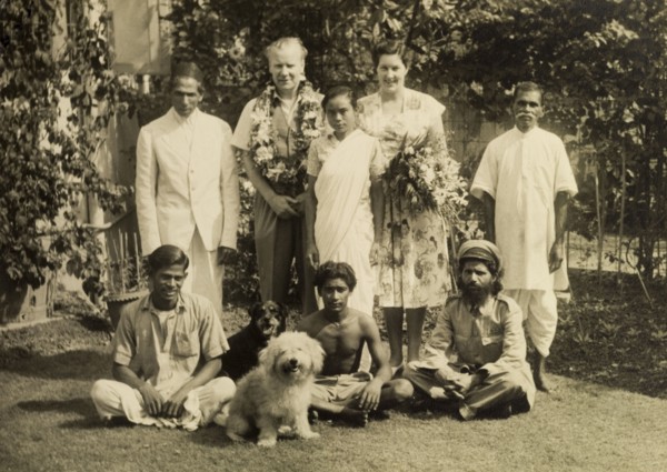 A typical a colonial household, India. Mr and Mrs Cater, adorned with flowers, pose for the camera