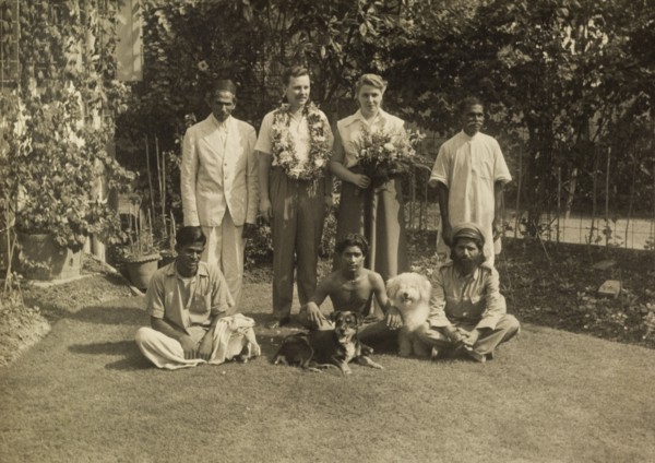Members of the Leonard household. Alan and Audrey Leonard, adorned with flowers, pose for the