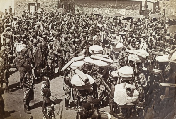 Crowds at a chief's funeral, Accra. An overhead photograph of a large mourning party gathered in