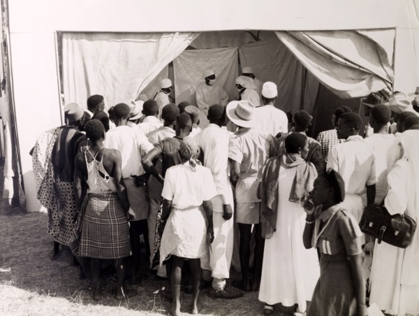 Public health demonstration. Official publicity shot for the Tanganyikan government. A crowd of