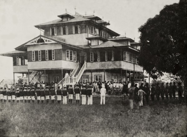 Empire Day at the Vice Consulate of Bonny. Lines of uniformed Nigerian men take part in a parade