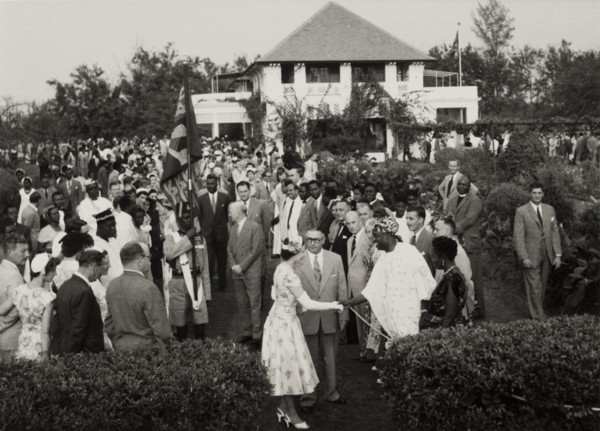 Queen Elizabeth II at a garden party in Nigeria. Queen Elizabeth II shakes hands with a Nigerian