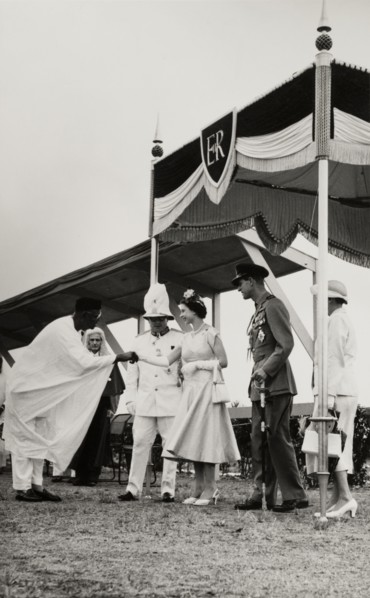 Queen Elizabeth II meets Dr Nnamdi Azikiwe. Dr Nnamdi Azikiwe, Premier of Eastern Nigeria, shakes