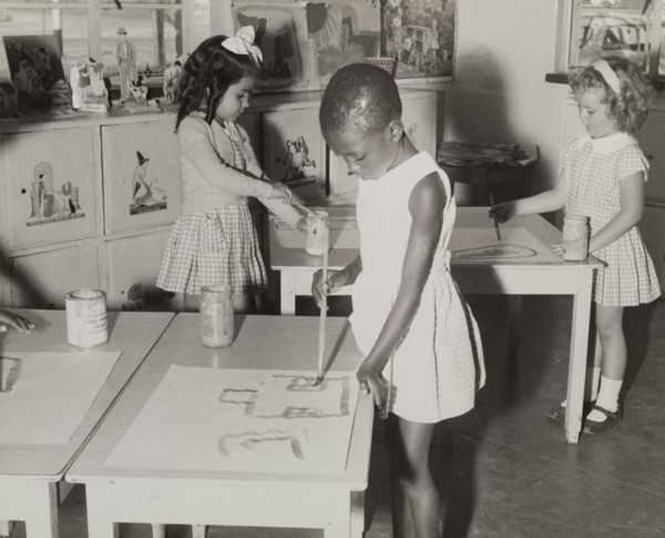A mixed race class. A Northern Rhodesian Information Department photograph shows three young