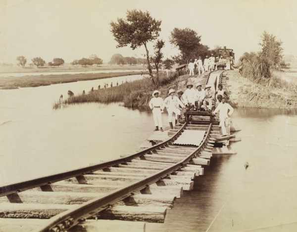 The pontoon line. A section of railway line stretches across a flooded river, supported only by a