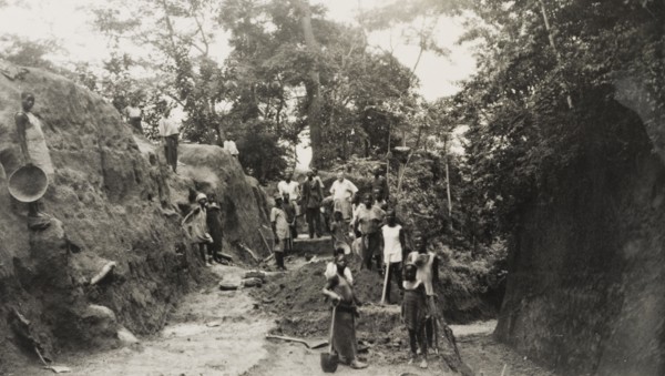 Widening the road from Imesi-Ile. A local labour force of men, women and children work to widen the
