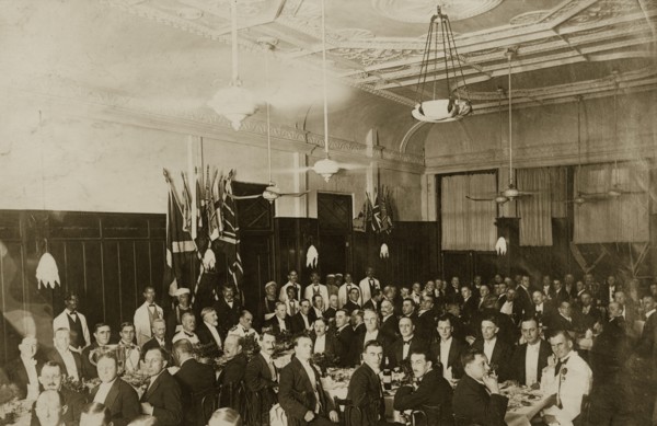 Burns Night in Bombay. A large group of formally dressed British gentlemen pose for the camera,