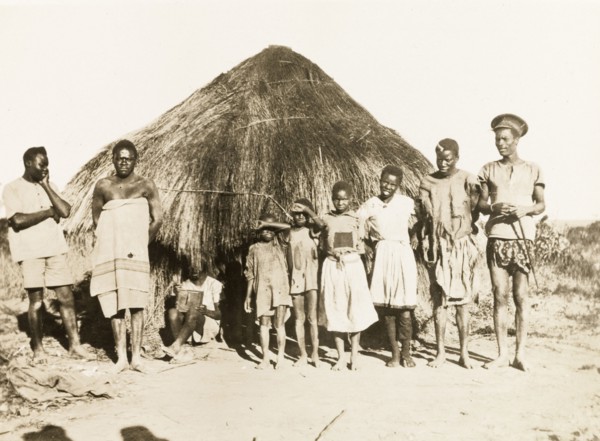 African workers and children at Balloch Farm. Portrait of a group of male African farm workers and