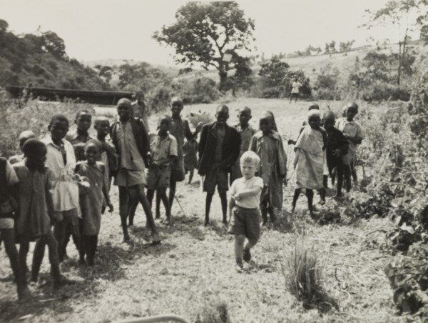 Neville Lewis plays with Kikuyu children. Neville Lewis, the eldest son of English Methodist
