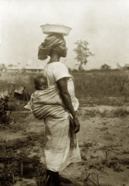 Nigerian woman and baby in profile. Profile portrait of a Nigerian women, identified by an original