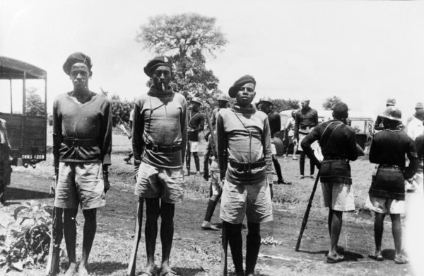 Three Home Guards. Three Kikuyu Home Guards stand to attention for their photograph, wearing
