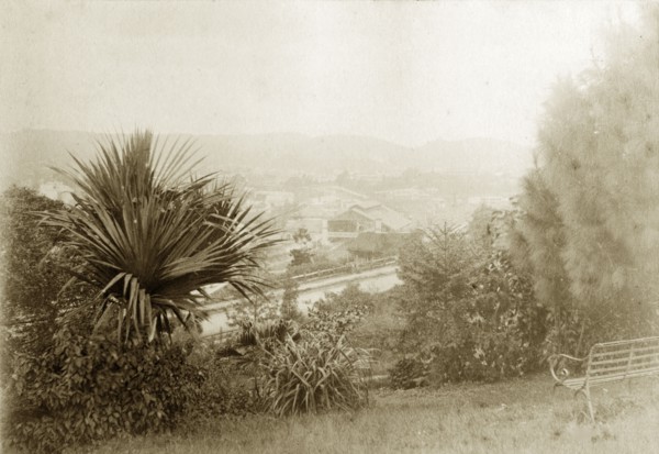 View from Wickham Terrace. A garden bench faces out over the city of Brisbane in the sloping