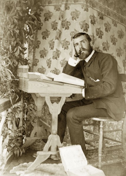 In contemplation with books, Australia. Amateur portrait of a man, possibly an Anglican vicar, in