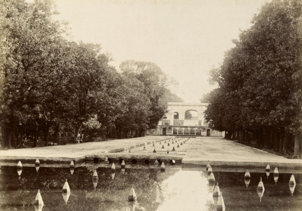 Fountains in the Shalimar Gardens. Long lines of trees surround a series of shallow canals fitted