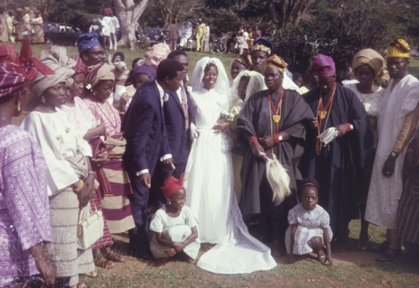 Sayo Bewaji's wedding'. Originally captioned as 'Sayo Bewaji's wedding', a bride and groom pose for
