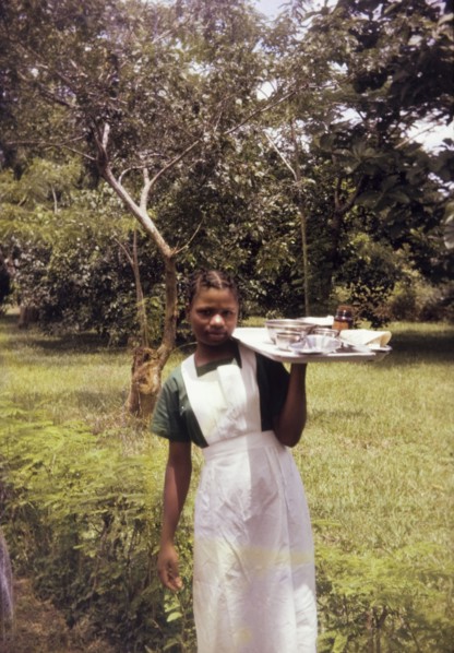 Training midwife, Nigeria. Outdoors portrait of a young woman training to become a midwife for a