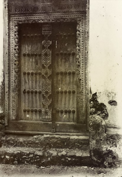 Ornate doorway, Zanzibar. An ornately carved wooden door in Zanzibar. Zanzibar (Tanzania), 1906.