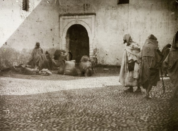 Street traders, Casablanca. Street traders attempt to catch passing trade on a cobbled street in