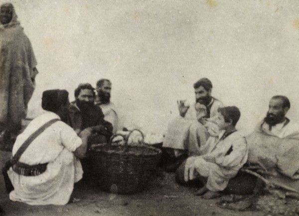 Jewish egg merchants. A group of Jewish egg merchants chat in a group around baskets containing